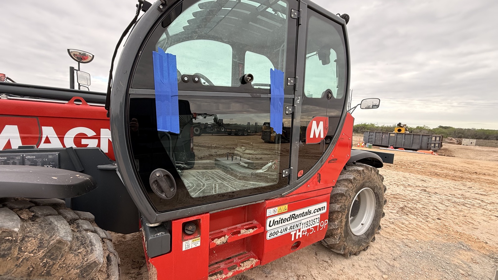 Telehandler with a glass cab serviced by South Texas Auto Glass, serving Alice, TX oilfield fleets across Jim Wells County