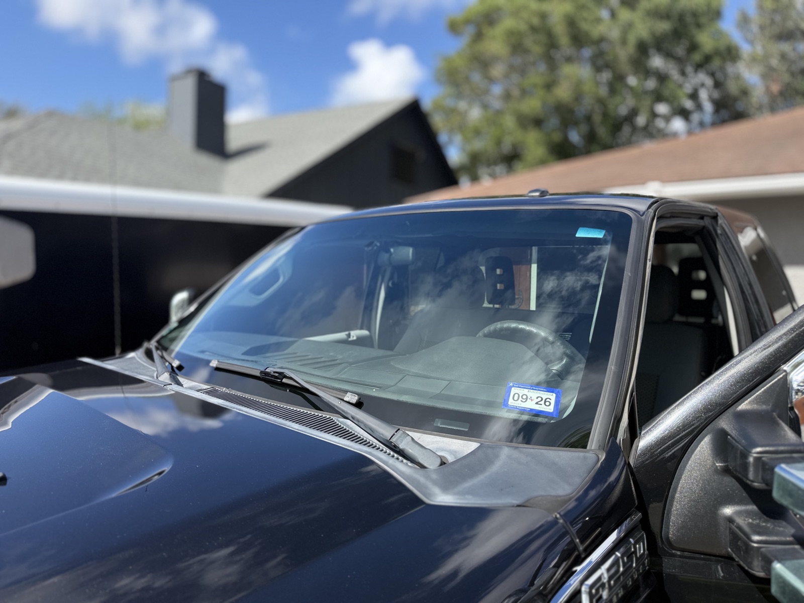 South Texas Auto Glass technician replacing the windshield on a crew-cab pickup in Corpus Christi, TX, with free mobile auto glass service across the Coastal Bend