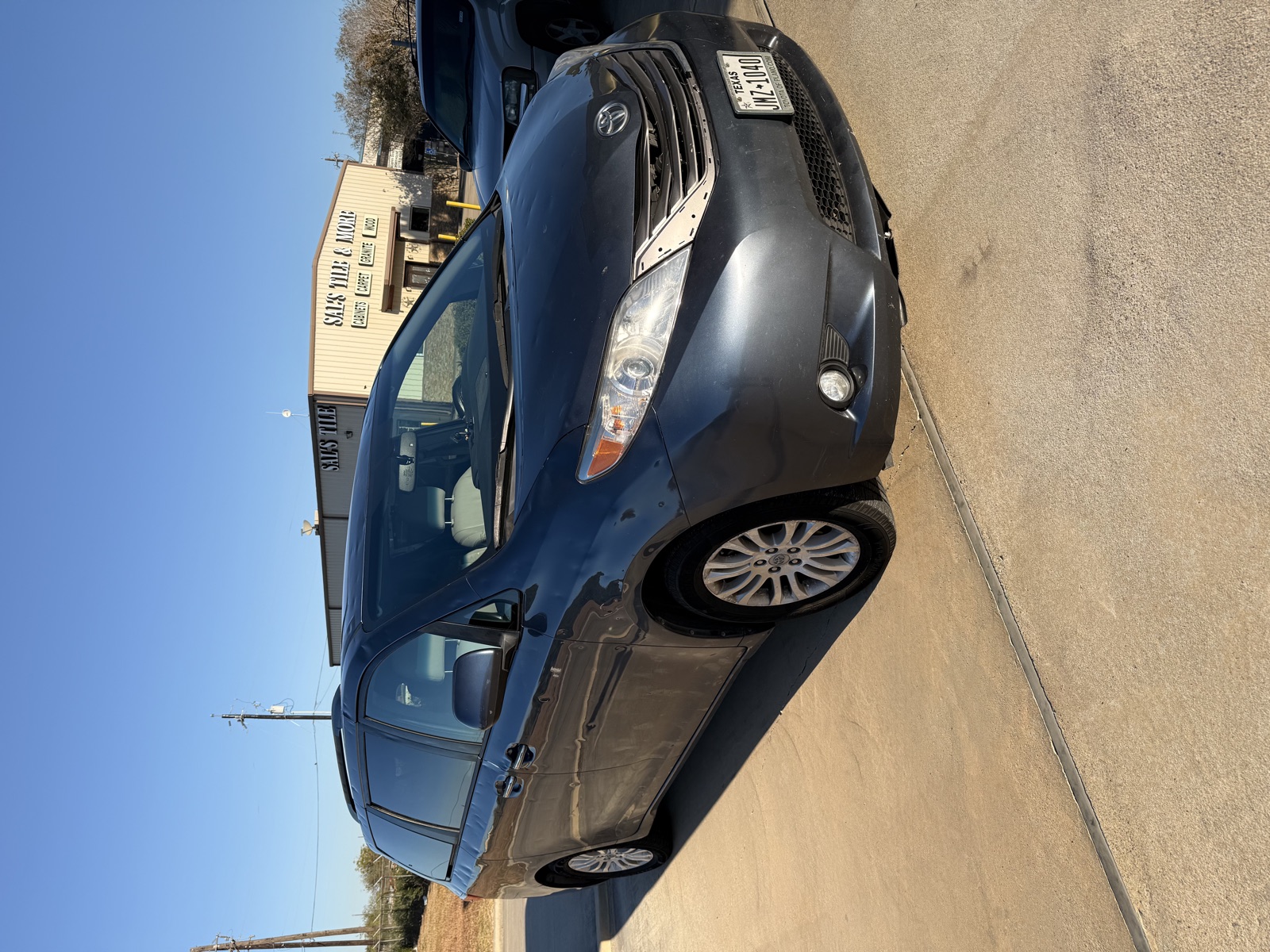 Toyota Sienna outside a building in Kingsville, TX after auto glass service by South Texas Auto Glass, with free mobile service across Kleberg County