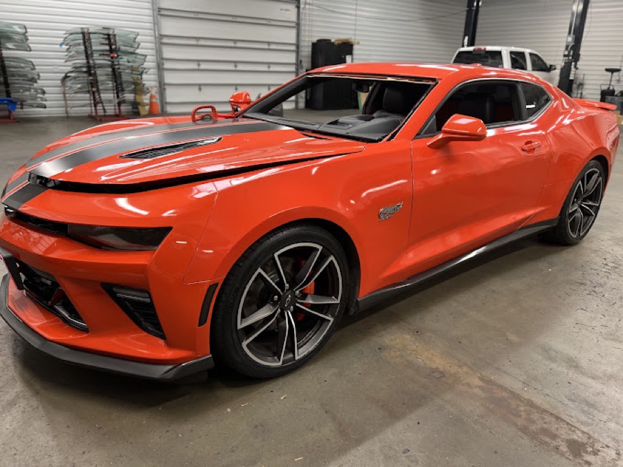 Orange Chevrolet Camaro SS in the South Texas Auto Glass shop in Corpus Christi, TX