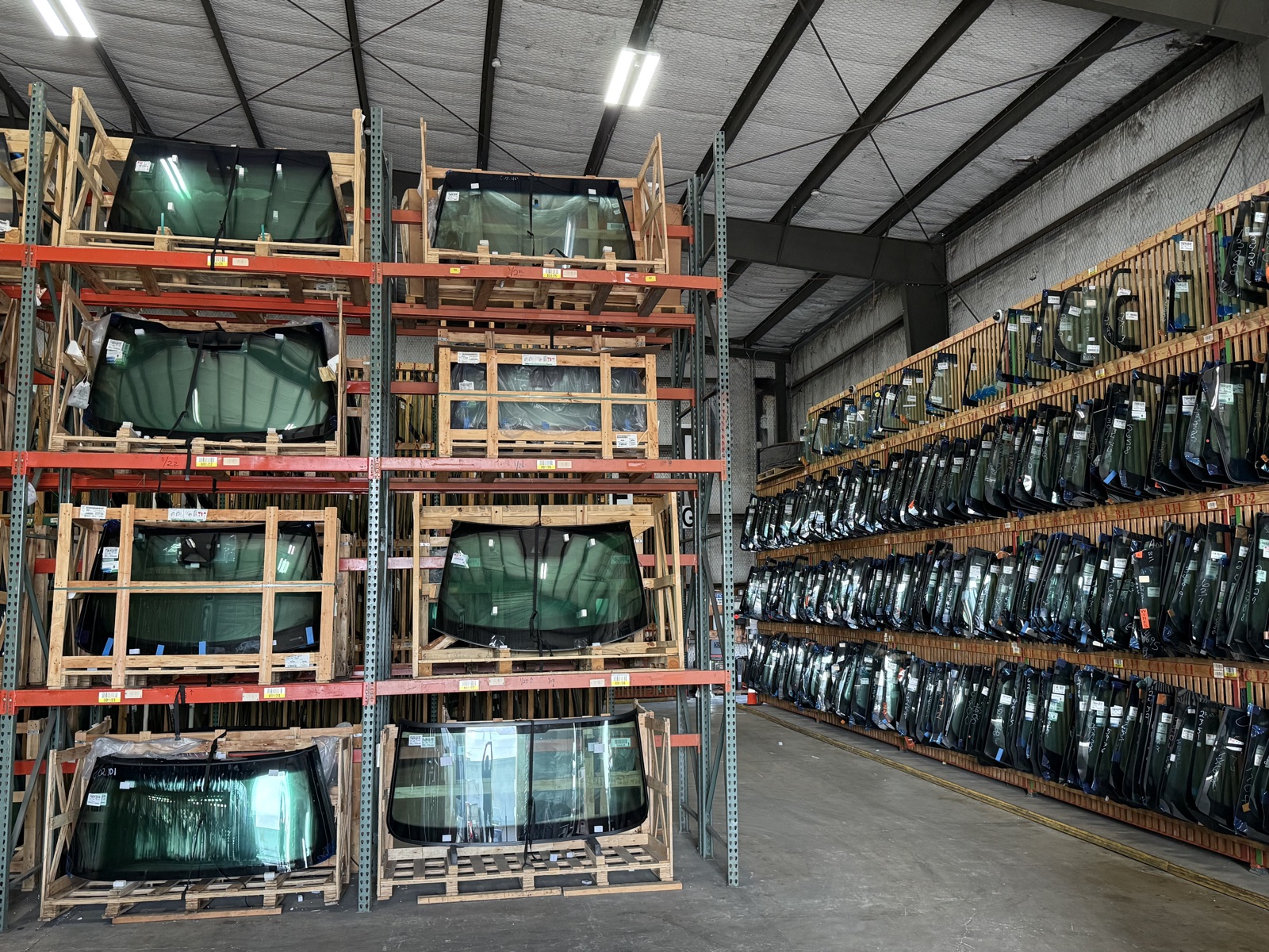 Rows of replacement windshields racked and in stock at the South Texas Auto Glass shop in Corpus Christi, TX